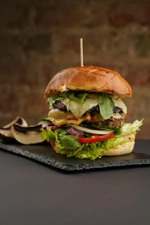 a hamburger sitting on top of a black plate