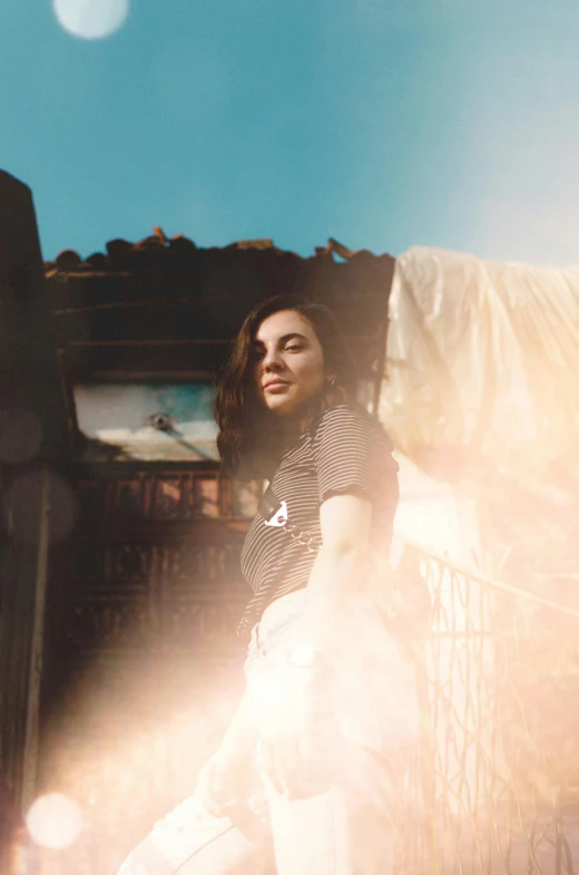 the woman sits on the porch of her house