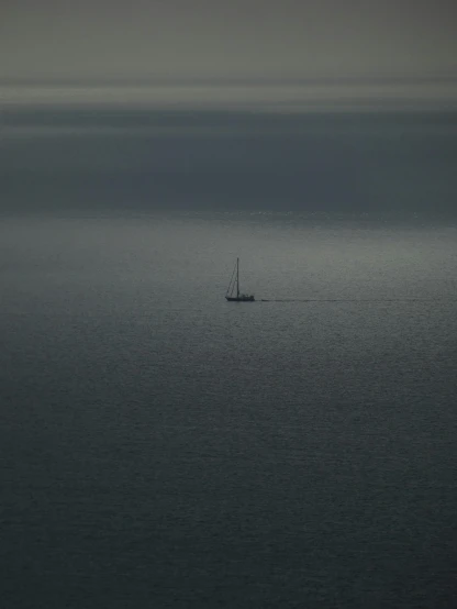 a boat is seen in the middle of the ocean