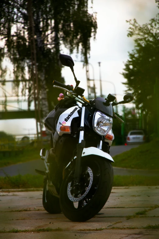 a motorcycle is parked with an odd helmet on it