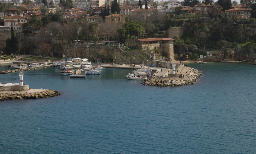 boats are anchored near the coast of a river