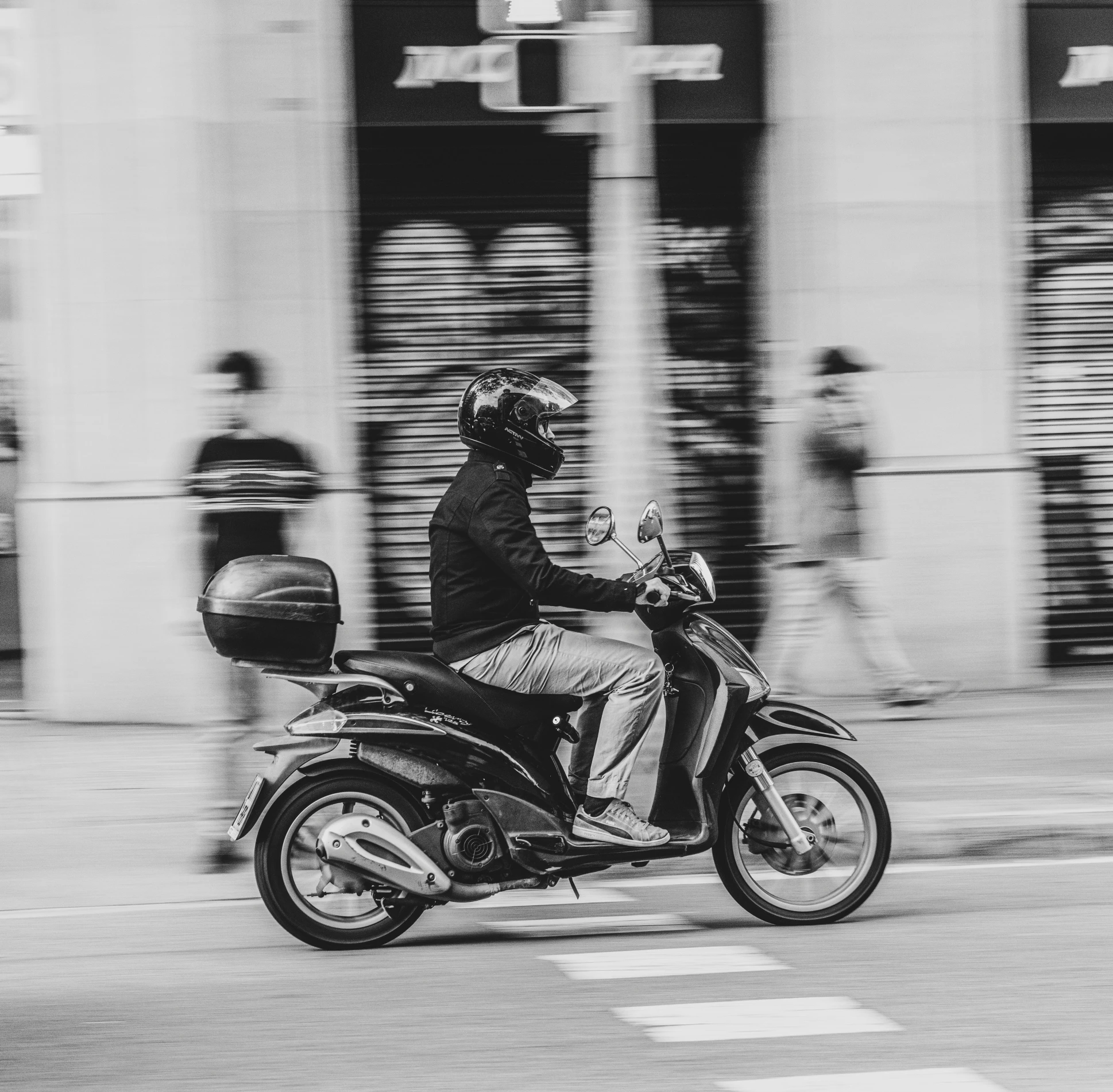 a person riding a motorcycle on the road