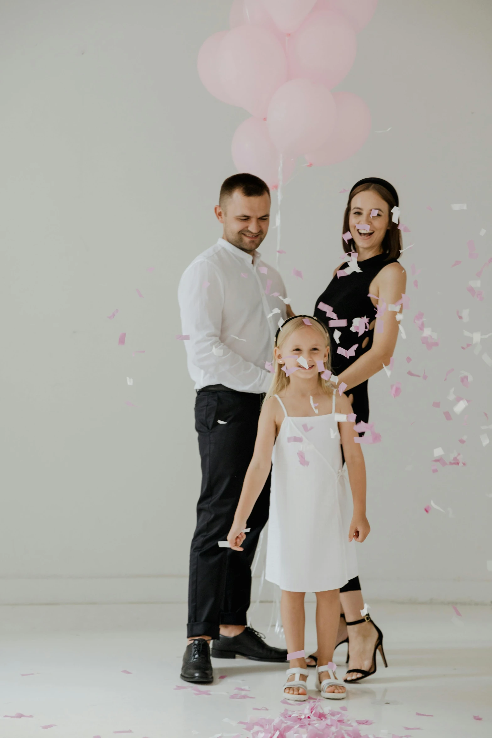 a father with his children is smiling for the camera