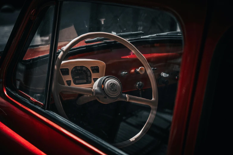 a close up of a car's steering wheel and dashboard