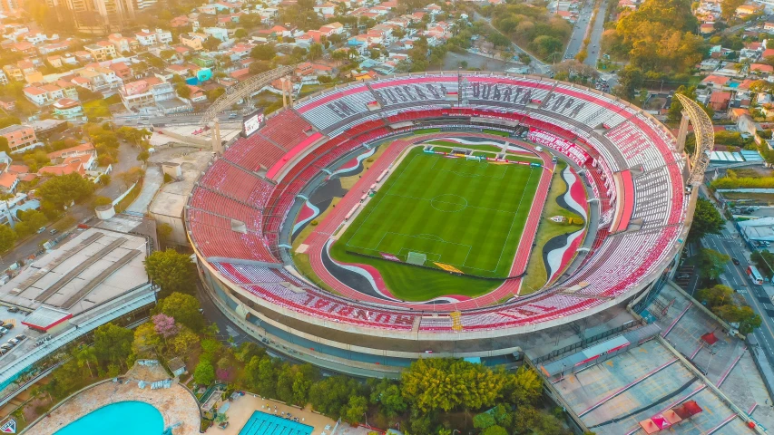 a soccer stadium with a red and white field