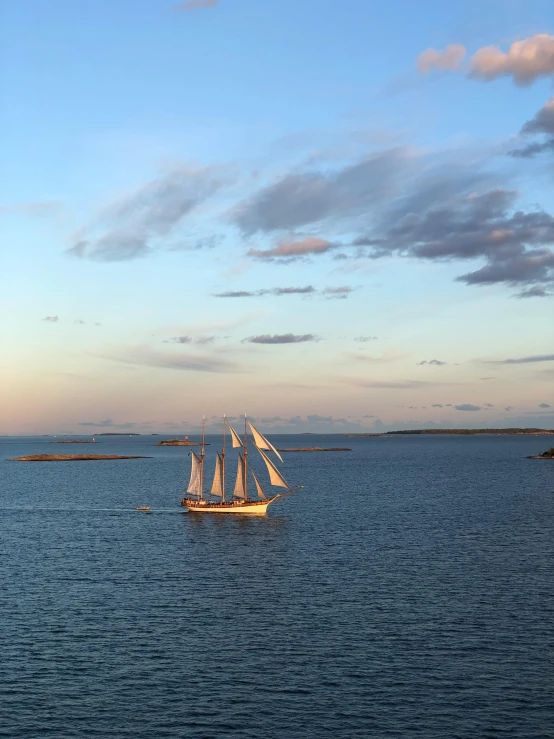 two boats on water with sky in the background