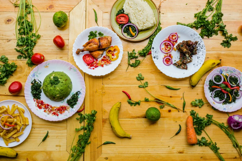 a bunch of food is laid out on plates