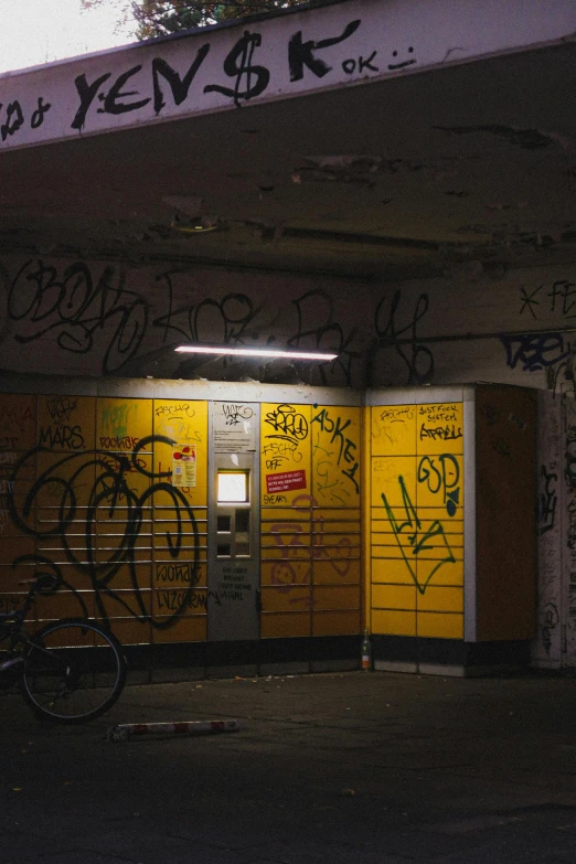 a building with a group of yellow doors in front of it