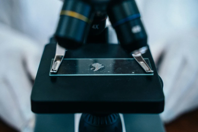 a close up of a camera with a pair of scissors