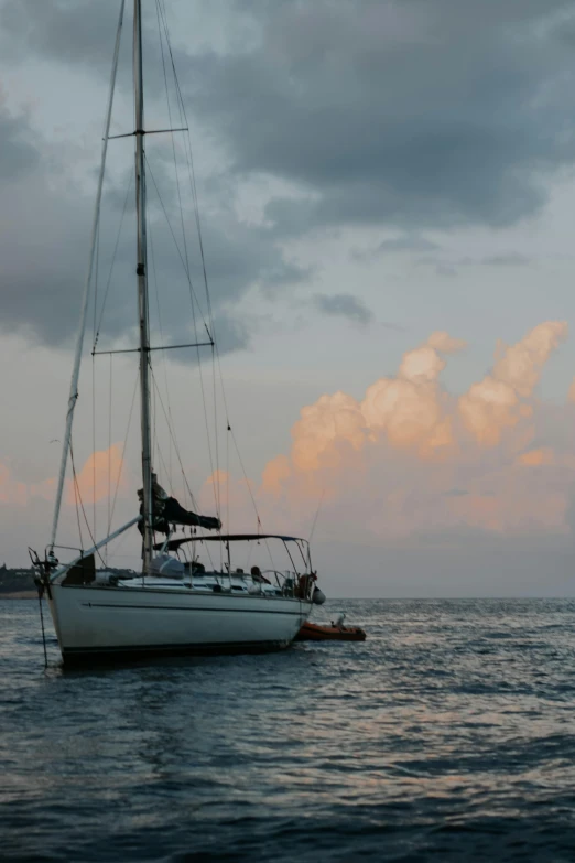 a sail boat that is out in the ocean