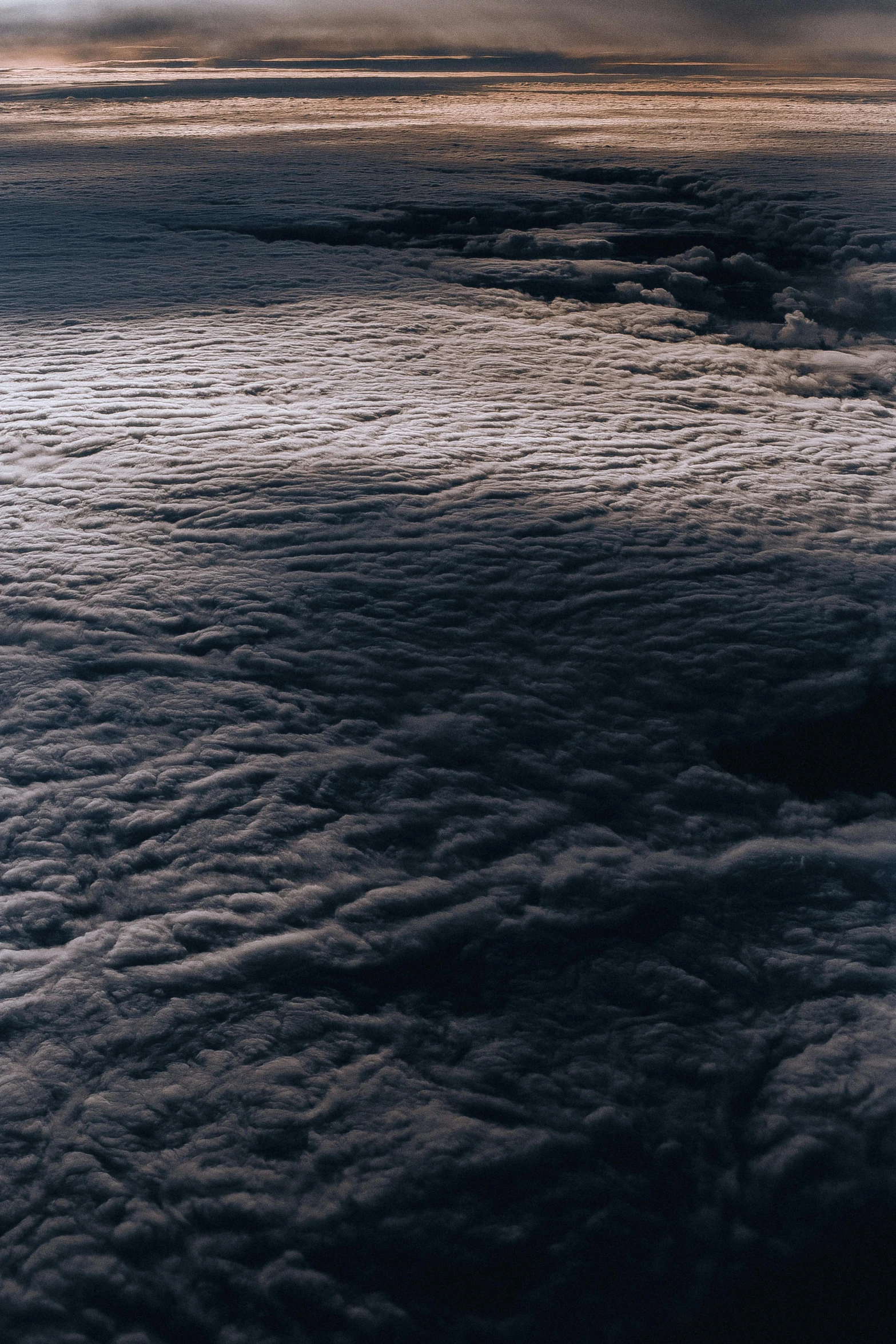 some clouds rolling in and the ground underneath