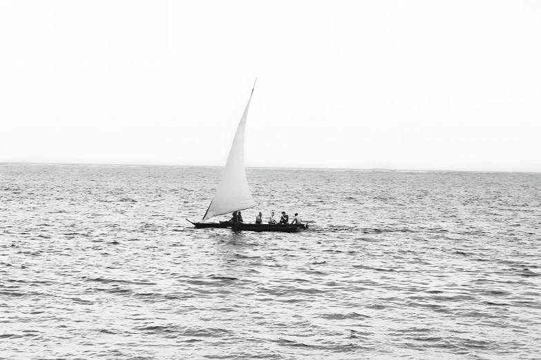 an airplane flies over a small boat on the water