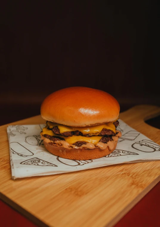 a hamburger is displayed on a  board