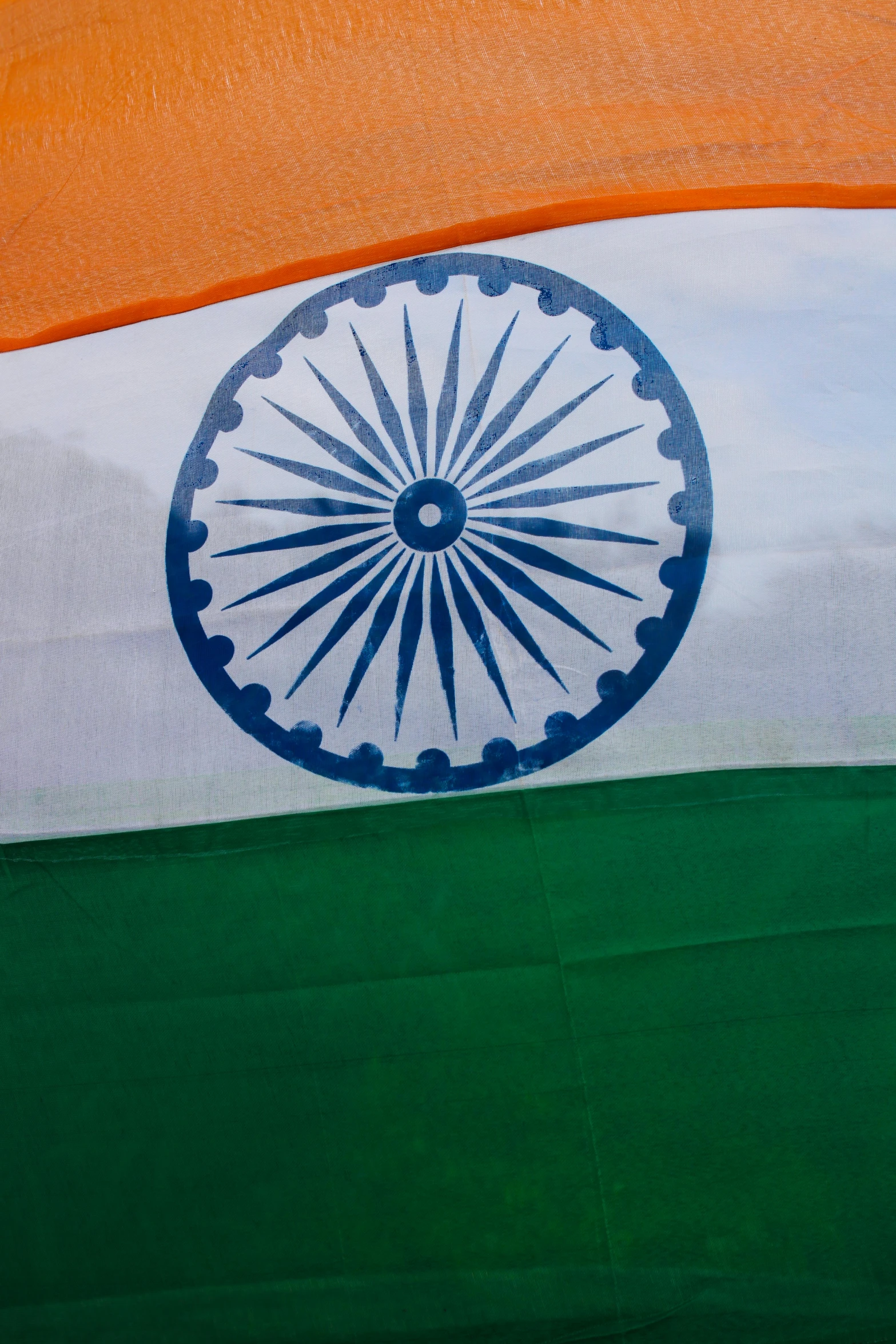 a large indian flag that has the colors of blue, green and orange