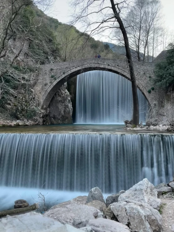 an image of the waterfalls under the bridge