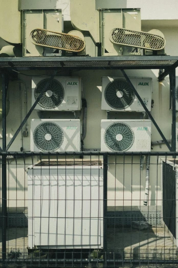 some air conditioners hanging over some sort of thing