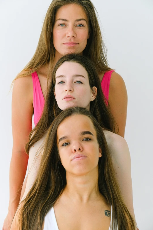 four women stand in a group posing for a portrait