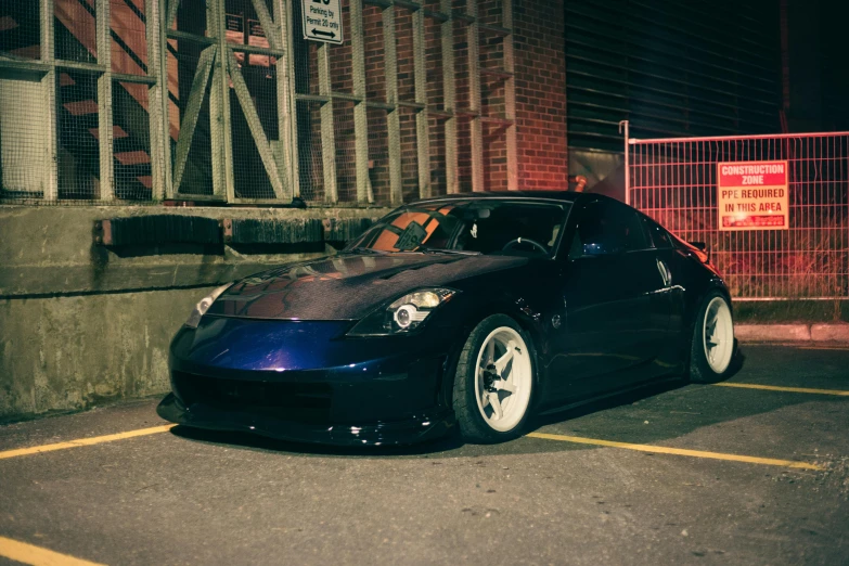 a parked black car in the parking lot