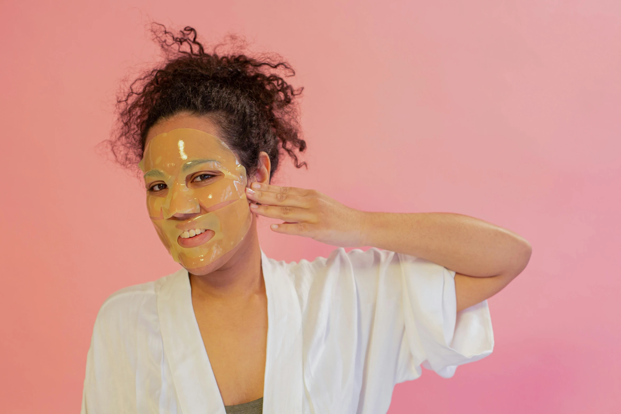 a woman with a clay mask around her face