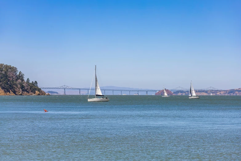 there are several boats sailing in the lake