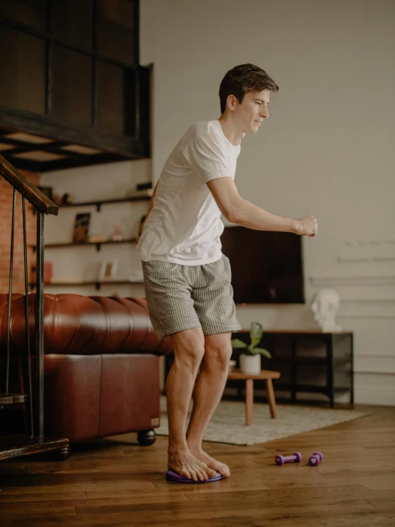  skating in a room in front of brown couch