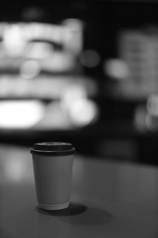 the empty takeout cup sits on the counter