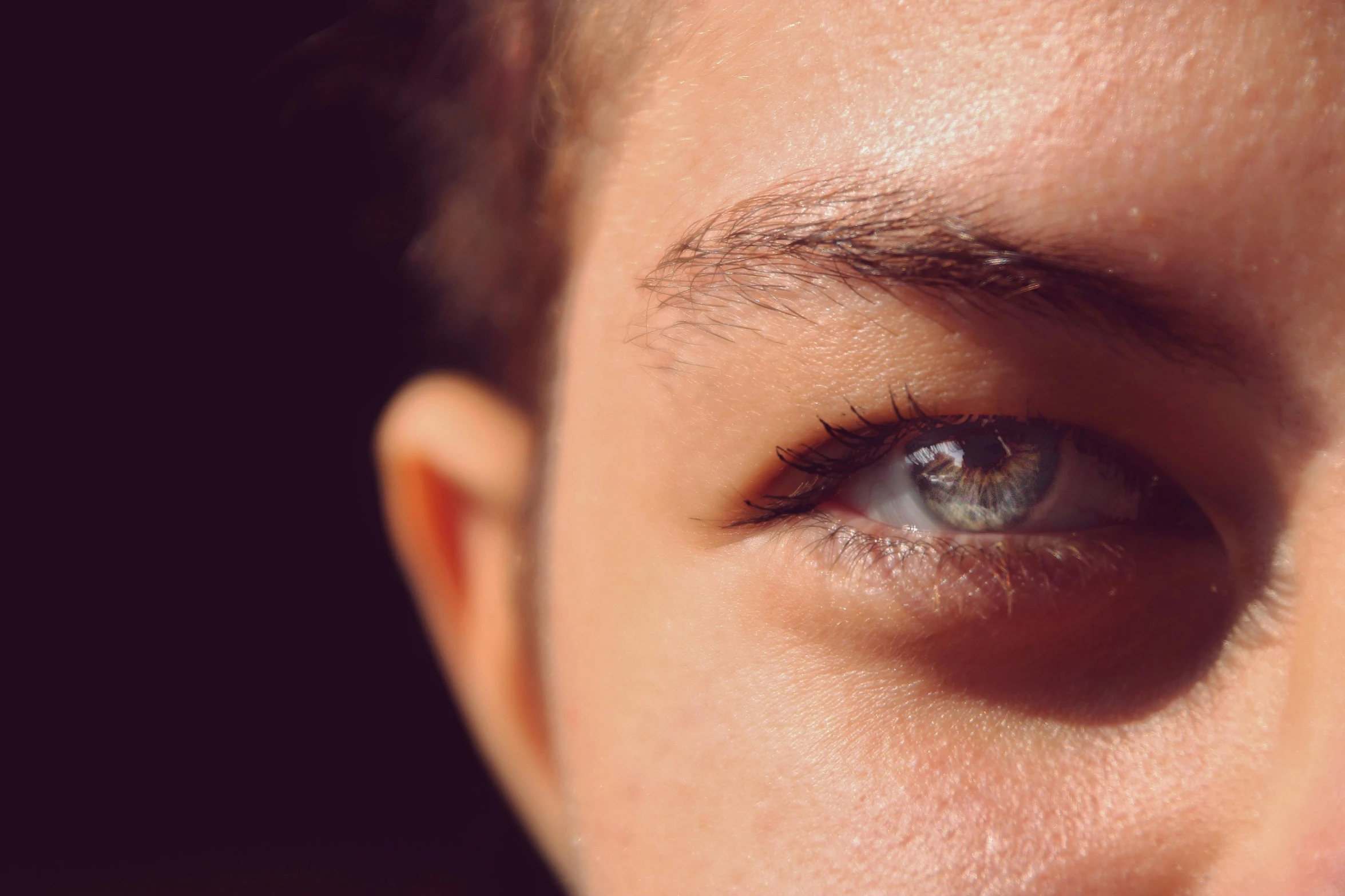 close up of eye and a man's face