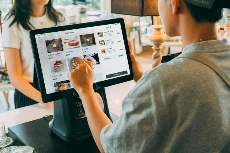 a woman ordering food while sitting at the counter