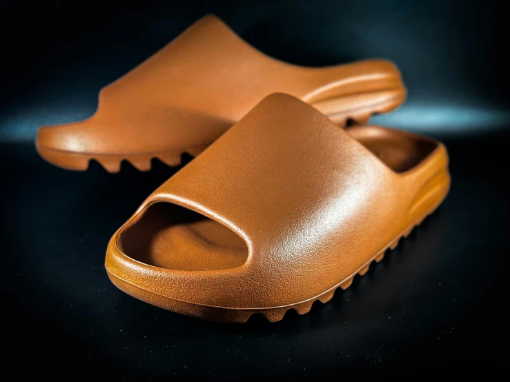 a pair of leather clogged mule shoes sitting on top of a table