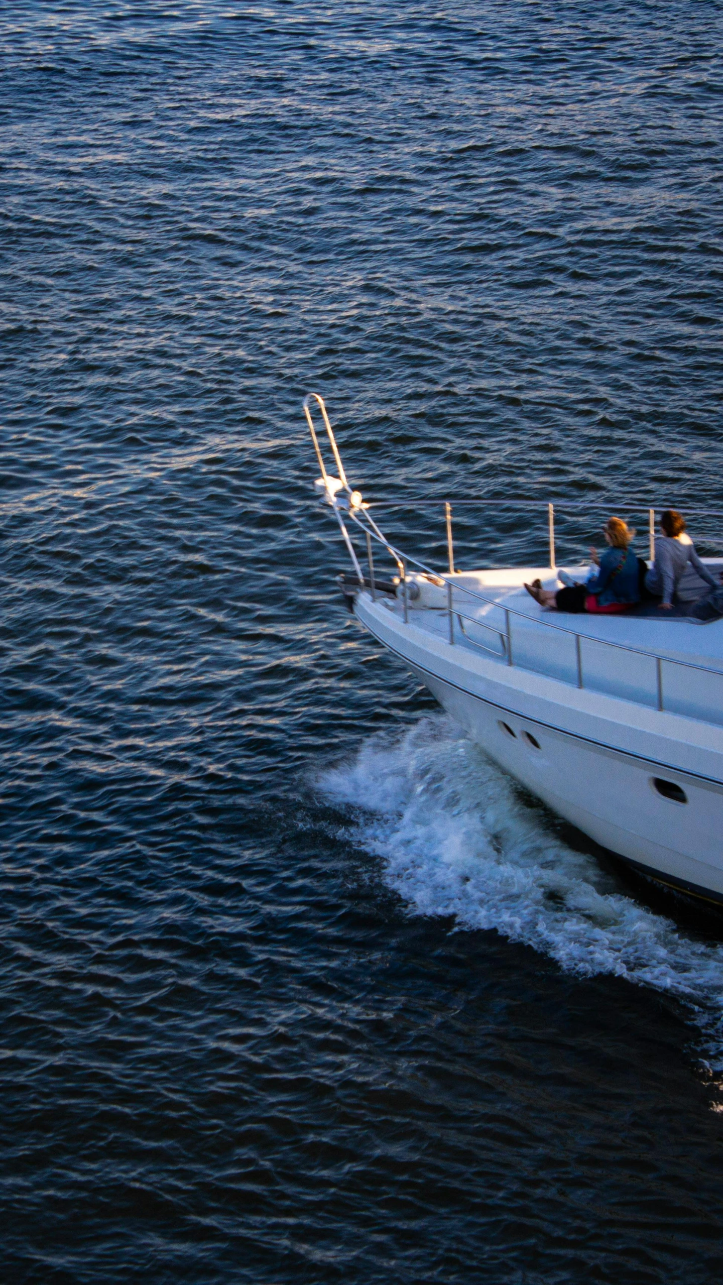 the two people are riding the boat across the water