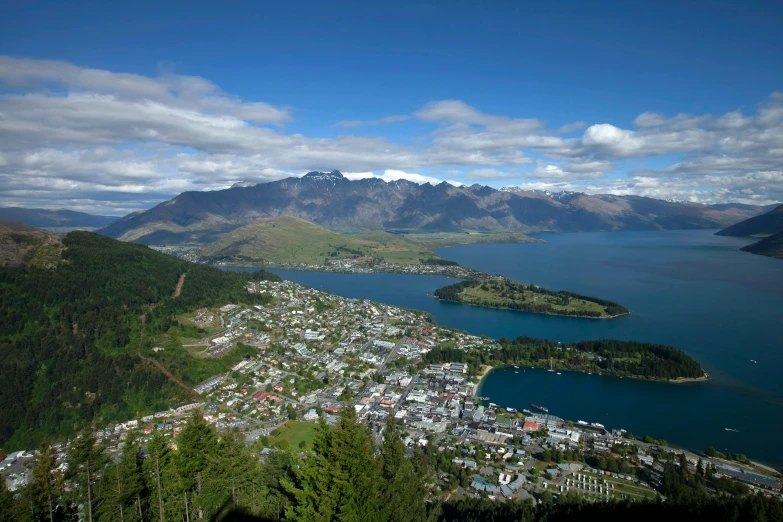 a view of a scenic town and some mountains