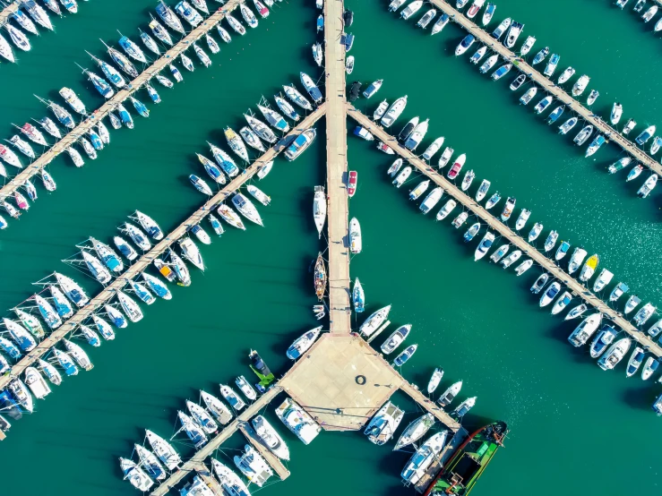 a number of boats in the water near one another