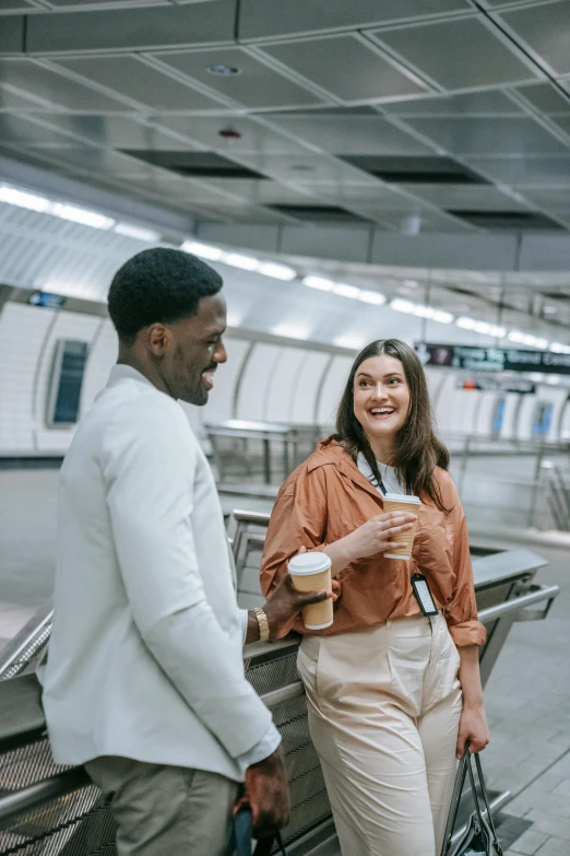 a couple standing on a platform and looking at each other