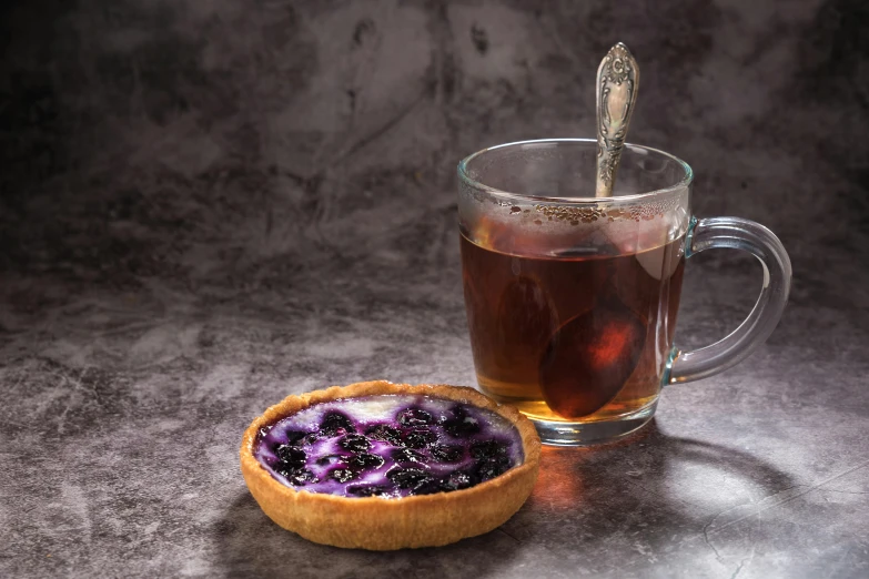 a piece of fruit and a glass of liquid