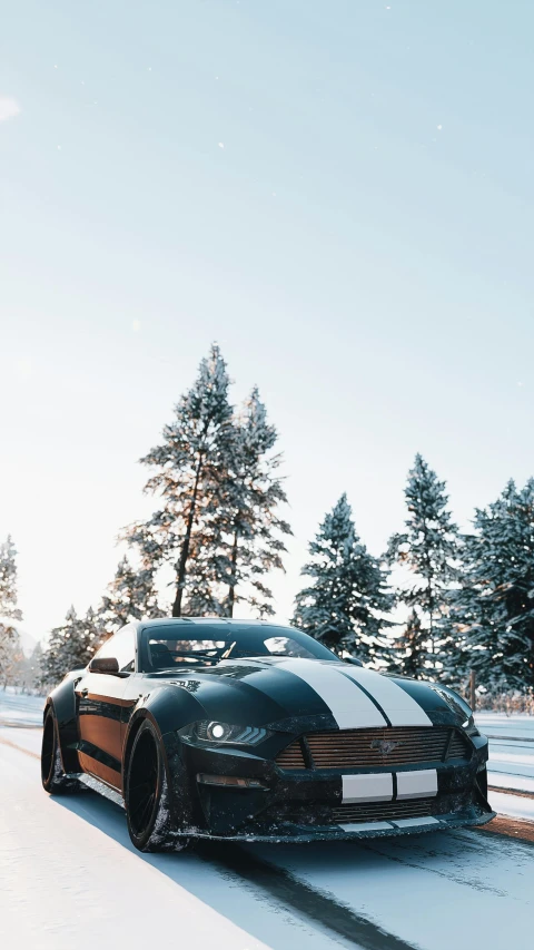 a car drives down the road in winter