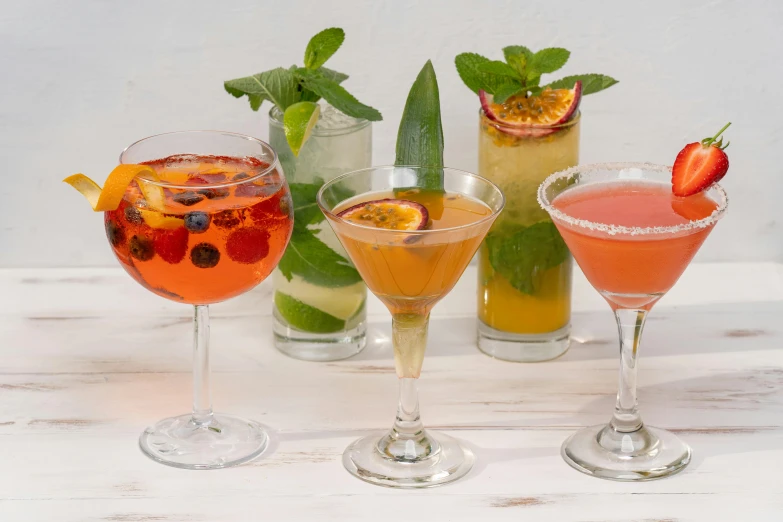 three different types of alcoholic cocktails on a table