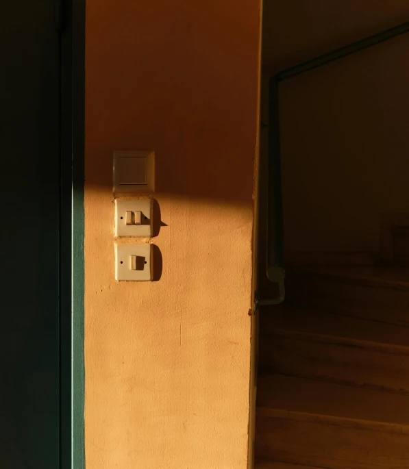 two outlets next to each other in a tan house