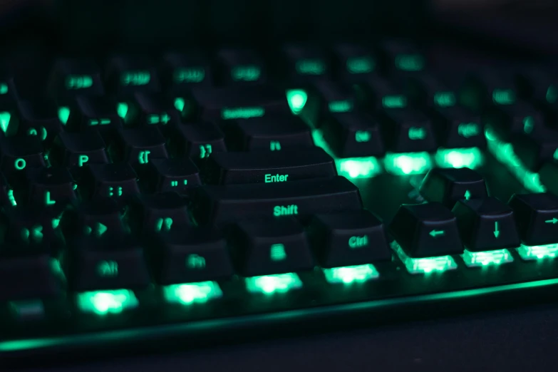 glowing keyboard keys and mouse with green backlit