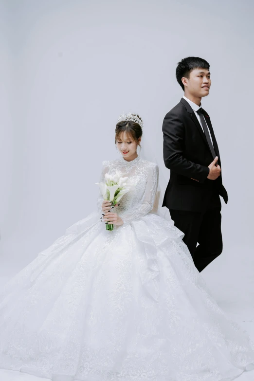 this bride has a bouquet of flowers by her side