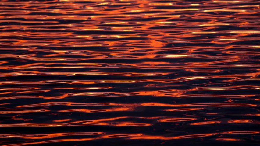 some water with lights reflecting off of it