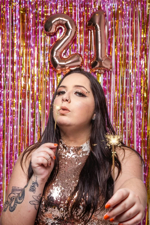 woman with face up, blowing out candles on her birthday