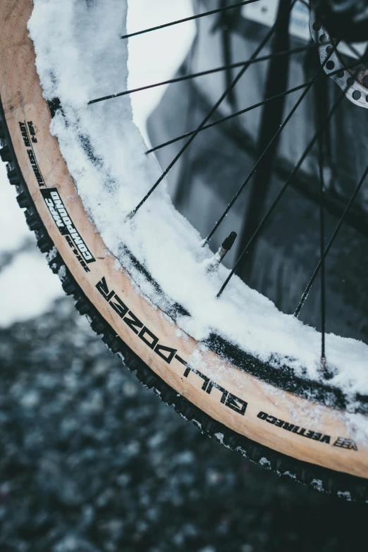 a snow covered bike tire and front tire rims