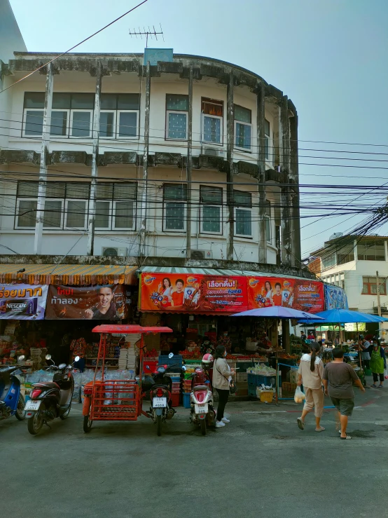 a building with shops on the street near by