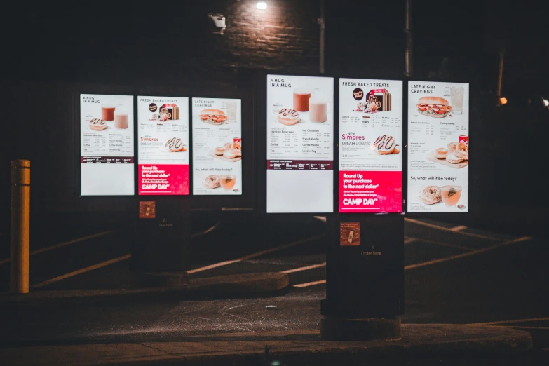 a menu at night with some light on