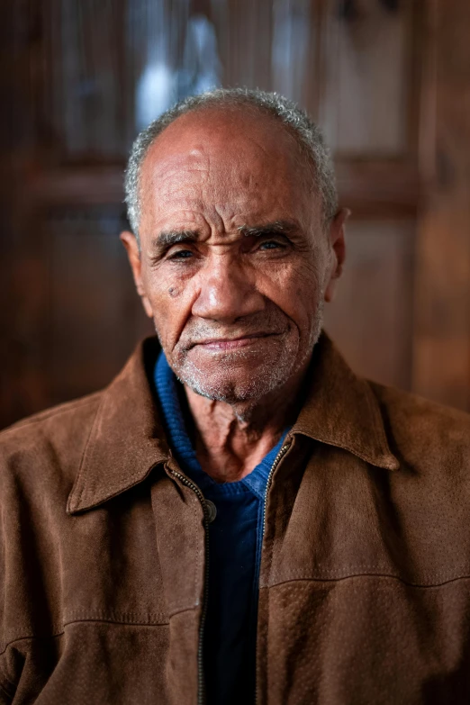 an old man smiling for the camera