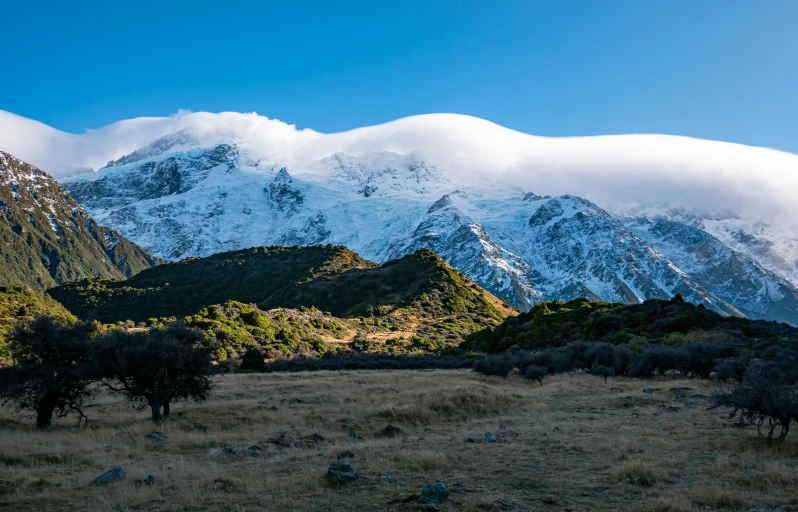 two big mountains that have snow on them