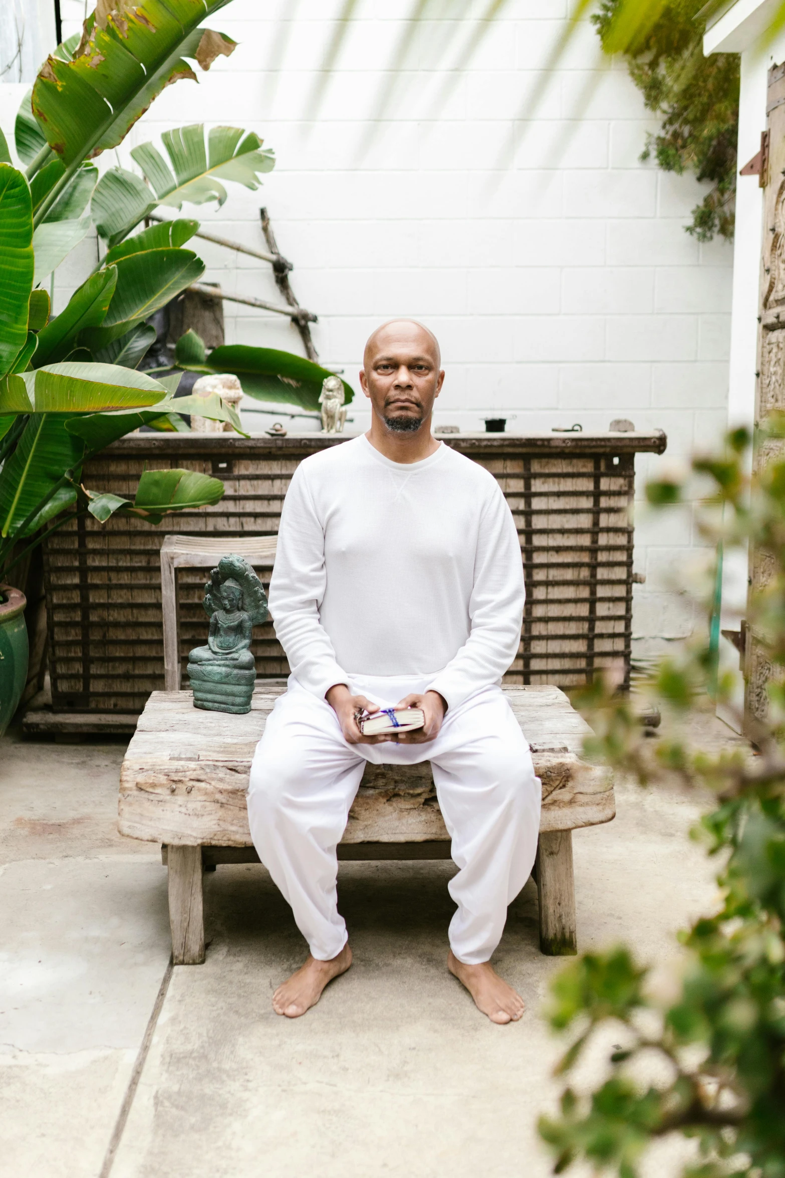 a person sitting on a bench in a house