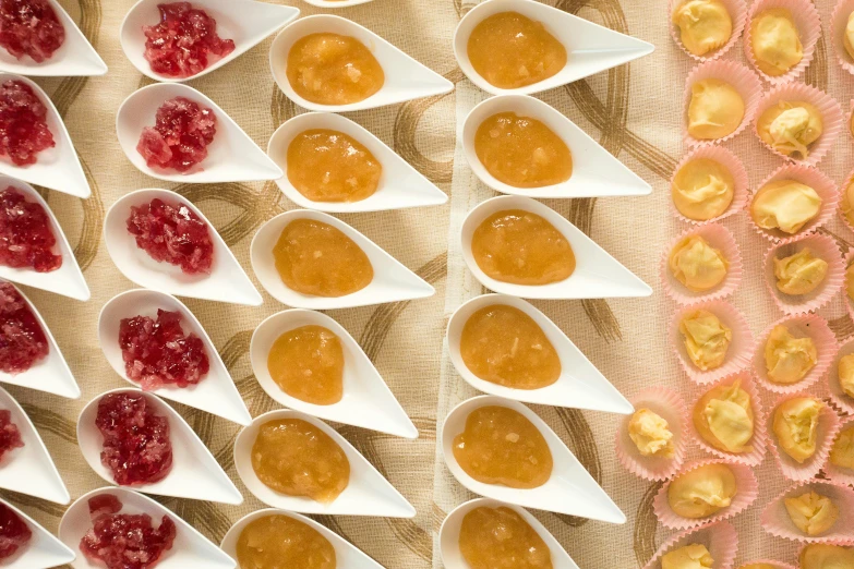 jelly filled dessert cups on small white dishes