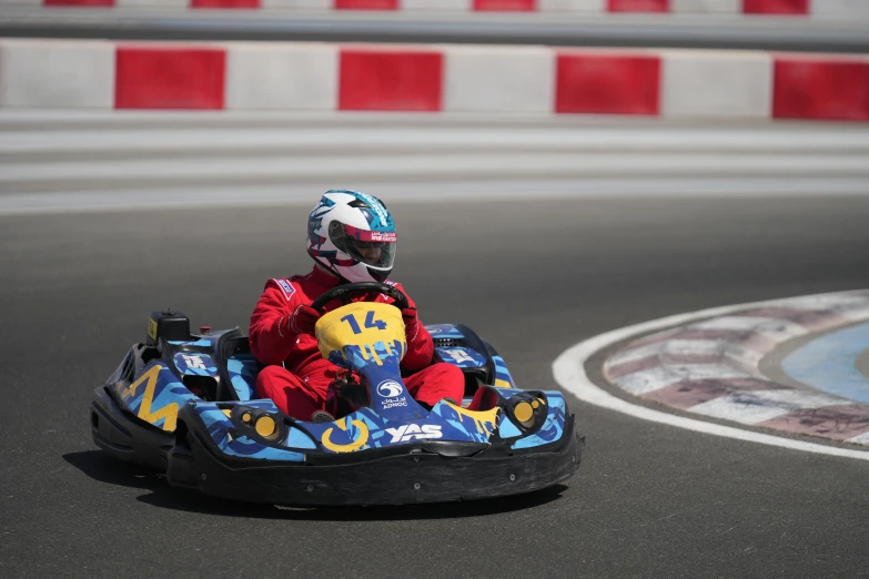 small  on go - kart racing around a track