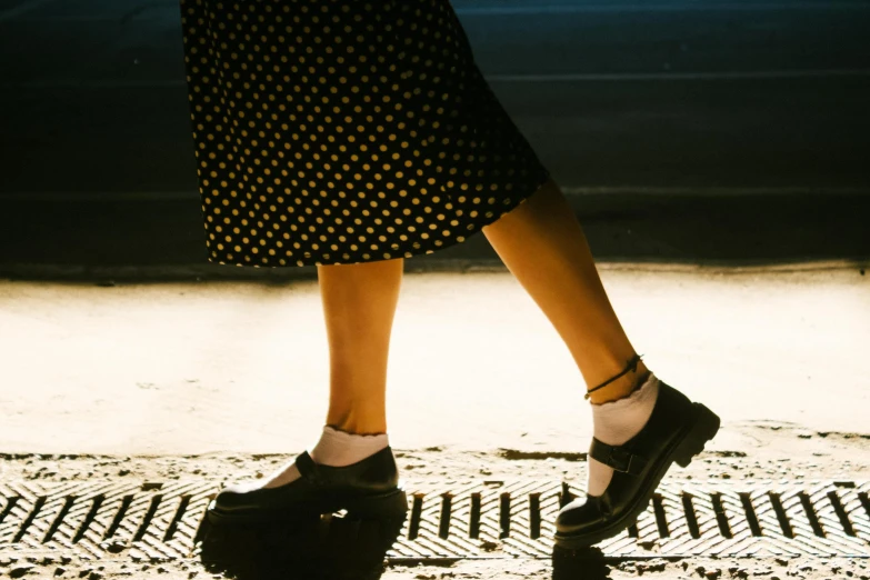 a woman's legs are seen from behind while walking